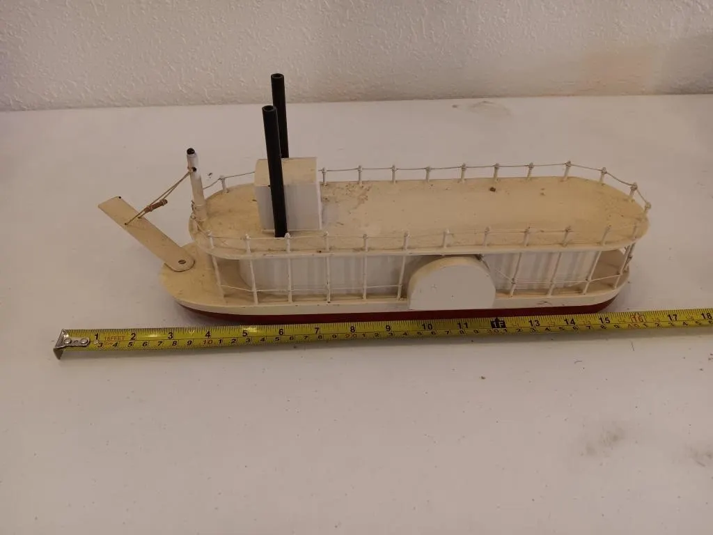 Wooden model of riverboat or paddle steamer.