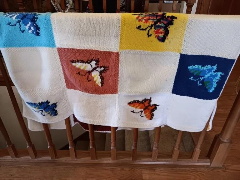 Knitted blanket with butterflies.
40 wide x 48
