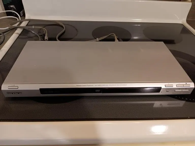 Sony DVD player and remote. Powered on.