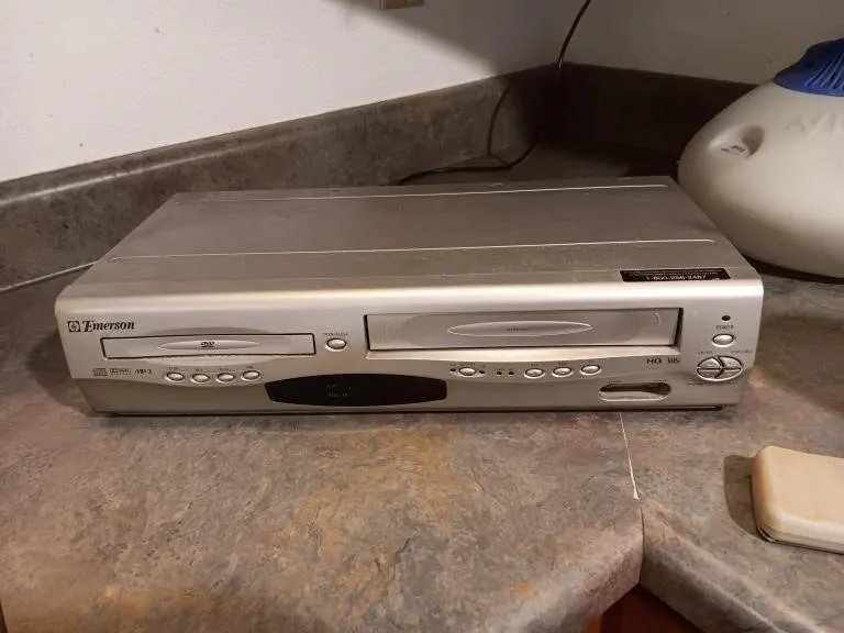 Emerson DVD and VHS player. Powered on.