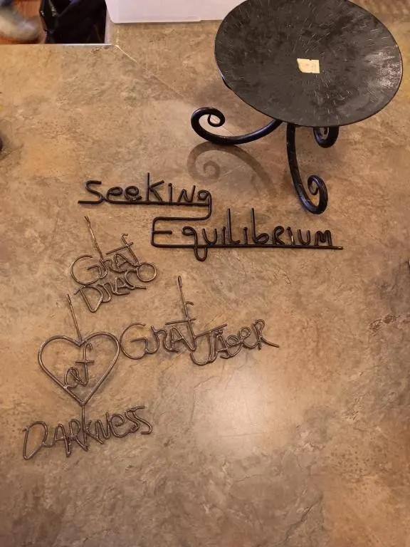 Appears to be handmade sayings, and decor stand.
