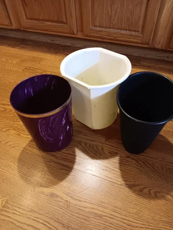 Three small trash cans