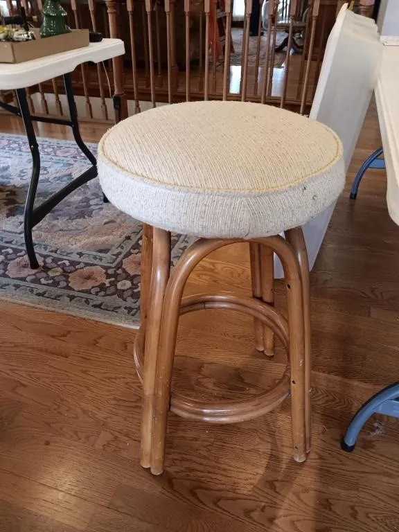 Bar stools, cream cushioned.