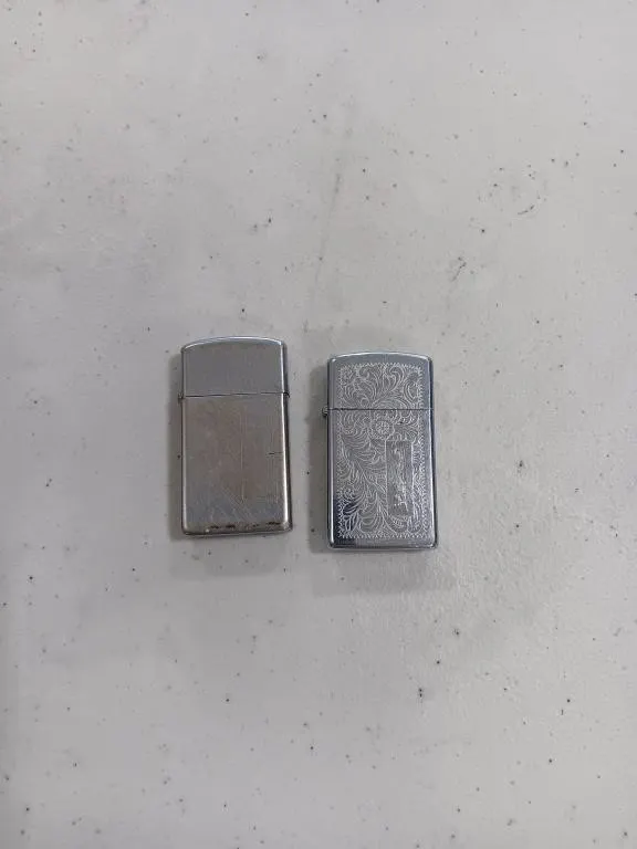 Two Zippo Lighters.