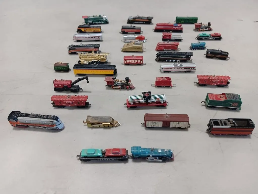 Miniature train Christmas ornaments.
Some by