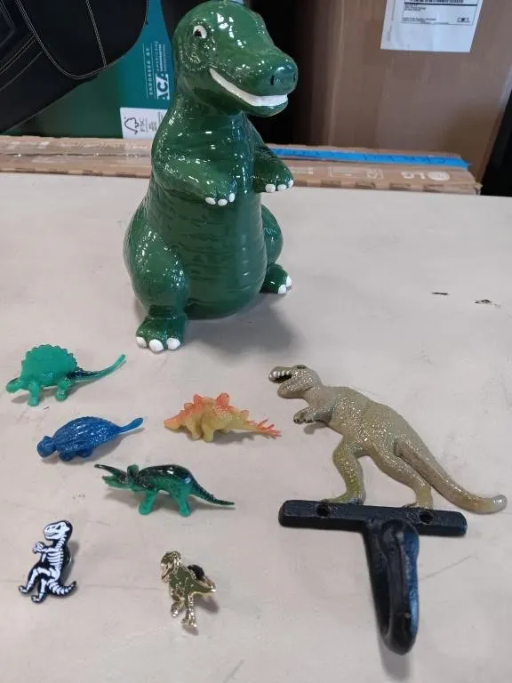 Dinosaur coin bank, coat hook,pins and more.