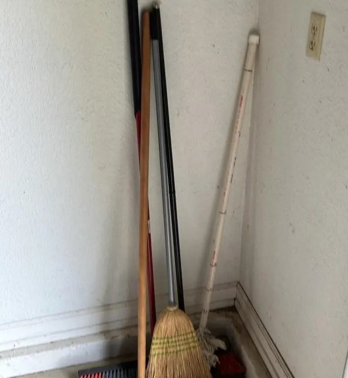 Collection of Cleaning Tools and Brooms