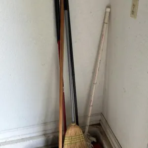 Collection of Cleaning Tools and Brooms