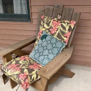 Two Wooden Adirondack Chairs and Two Footstools