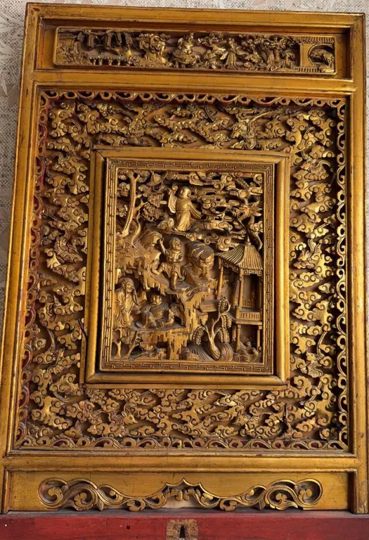Chinese Carved and Gilt Wood Panel with Figural and Architectural Motifs