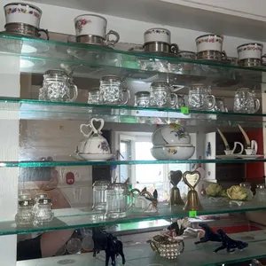 Collectables Including Porcelain Cups, Glass Jar Mugs, Miniatures, Shelves Not Included