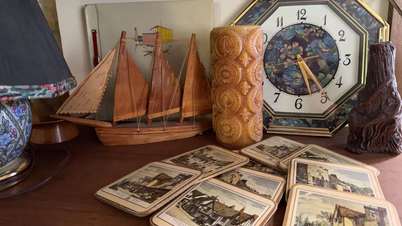 Lot: Model Sailboat, Mantel Clock, Candles, Decorative Cards, and Table Lamp