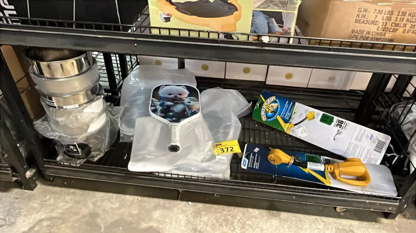 SHELF OF STAINLESS STEEL FLAT BOTTOM BOWLS, PICKLEBALL PADDLES & RV ELECTRICAL ADAPTERS
