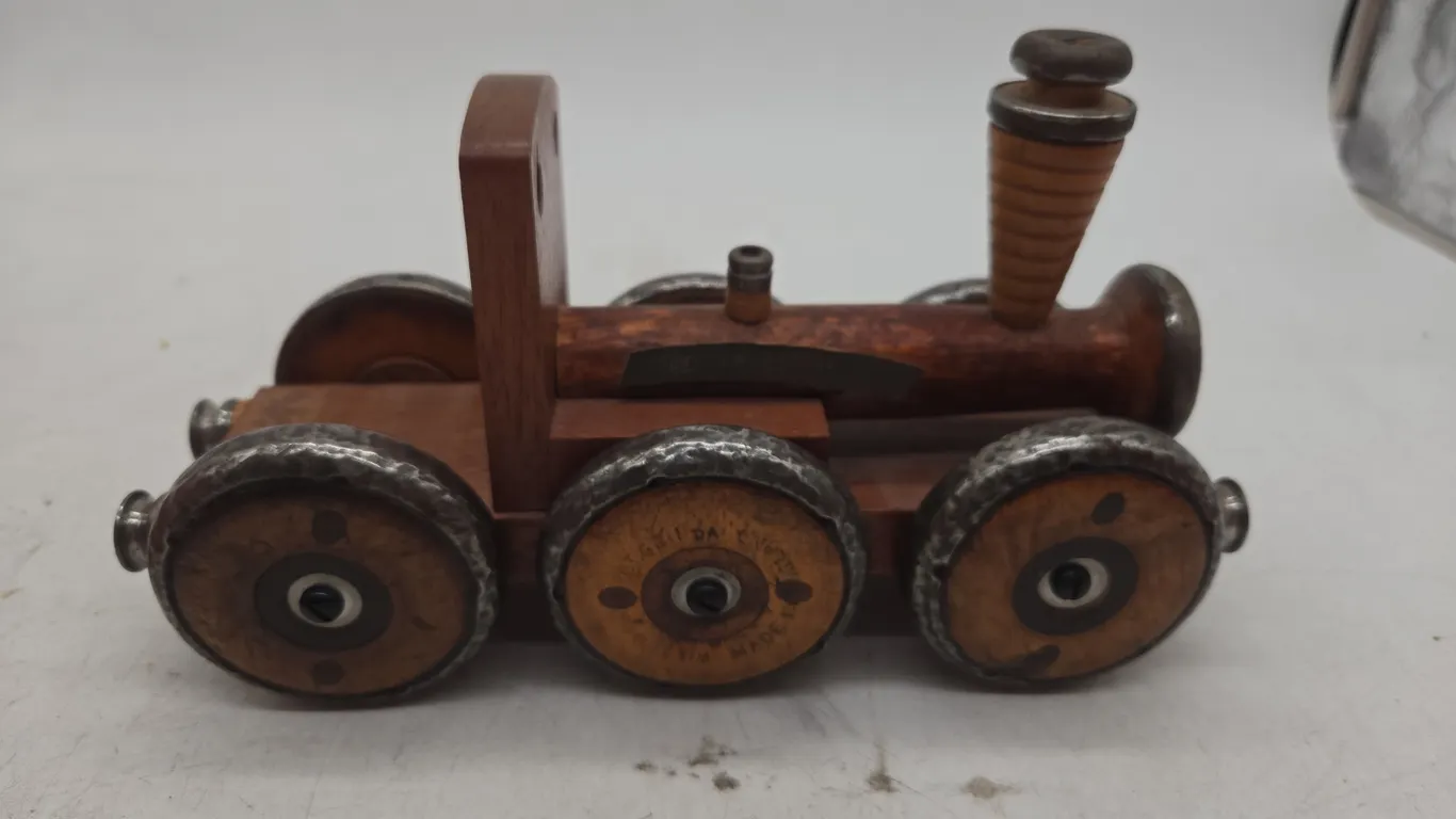 Antique wooden train made out of antique wooden thread spools