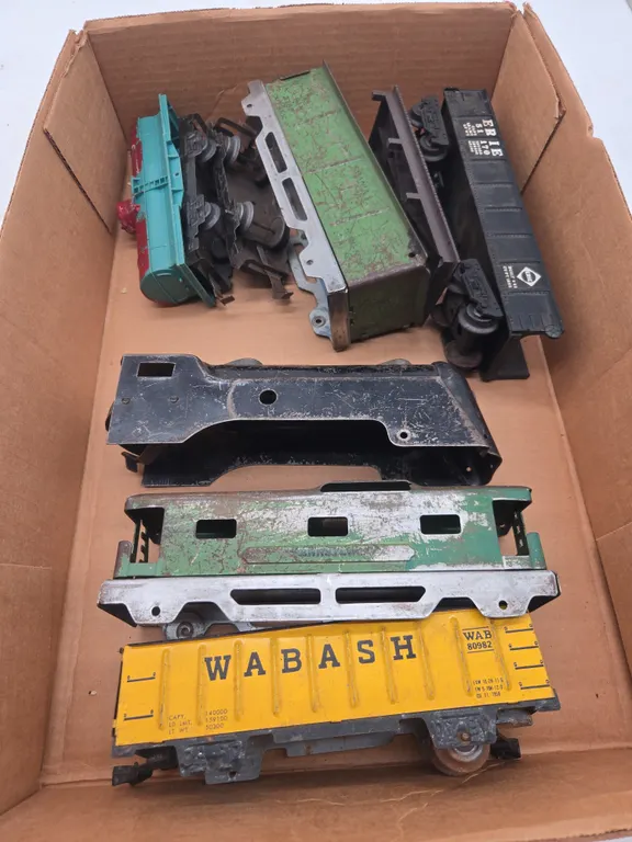 Assorted vintage steel-bodied train cars