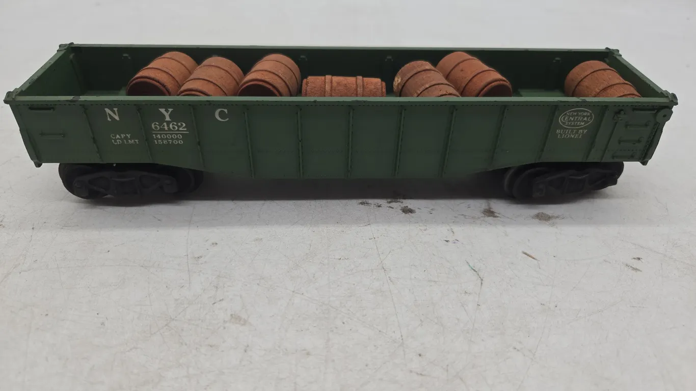 Vintage Lionel number 64 6225 New York Central gondola car with a barrels