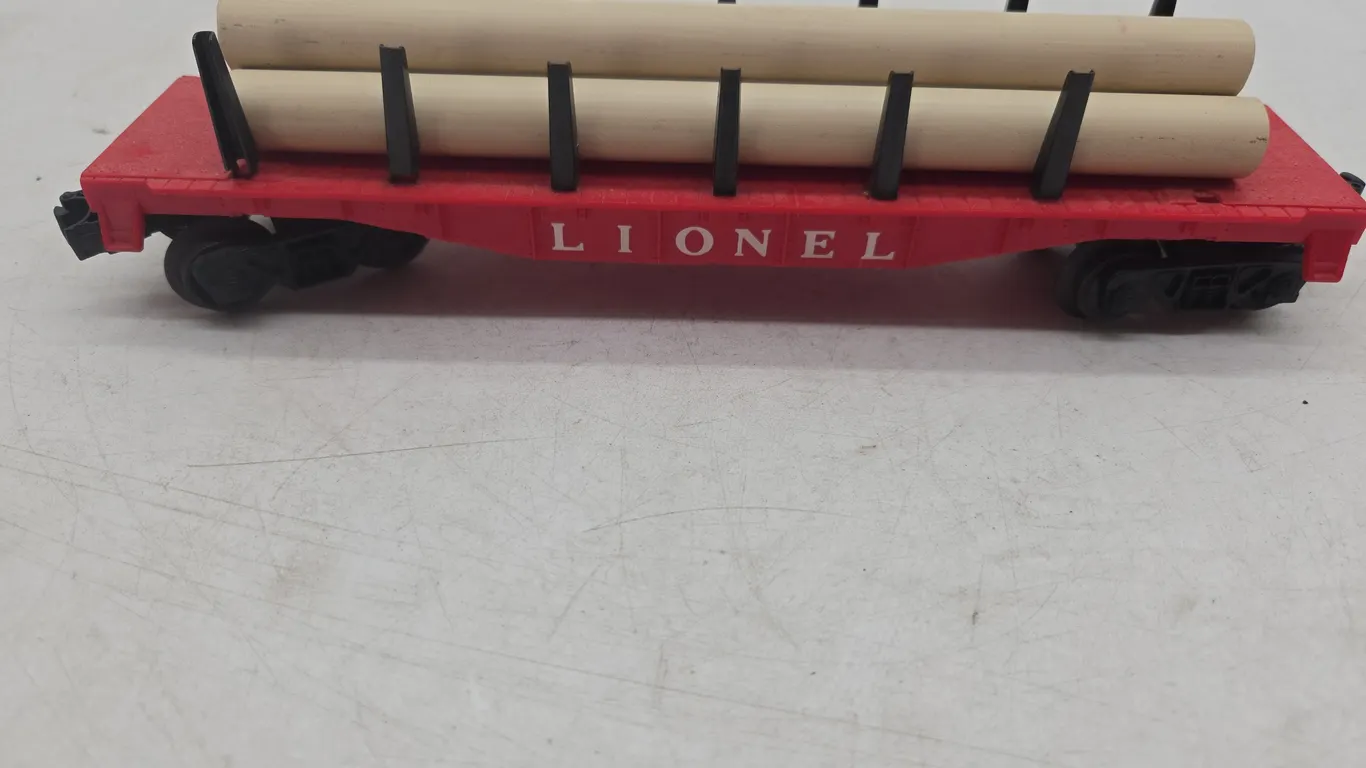 Vintage Lionel number 65112 flat car with pipes