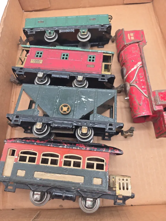 Assorted vintage Lionel lines metal lithograph train cars