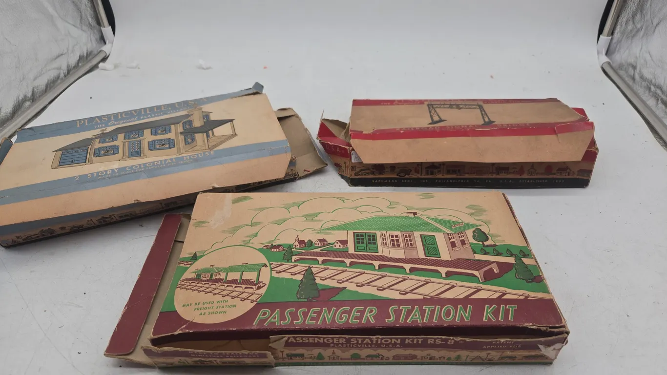 Assorted vintage plasticville train accessories in original boxes