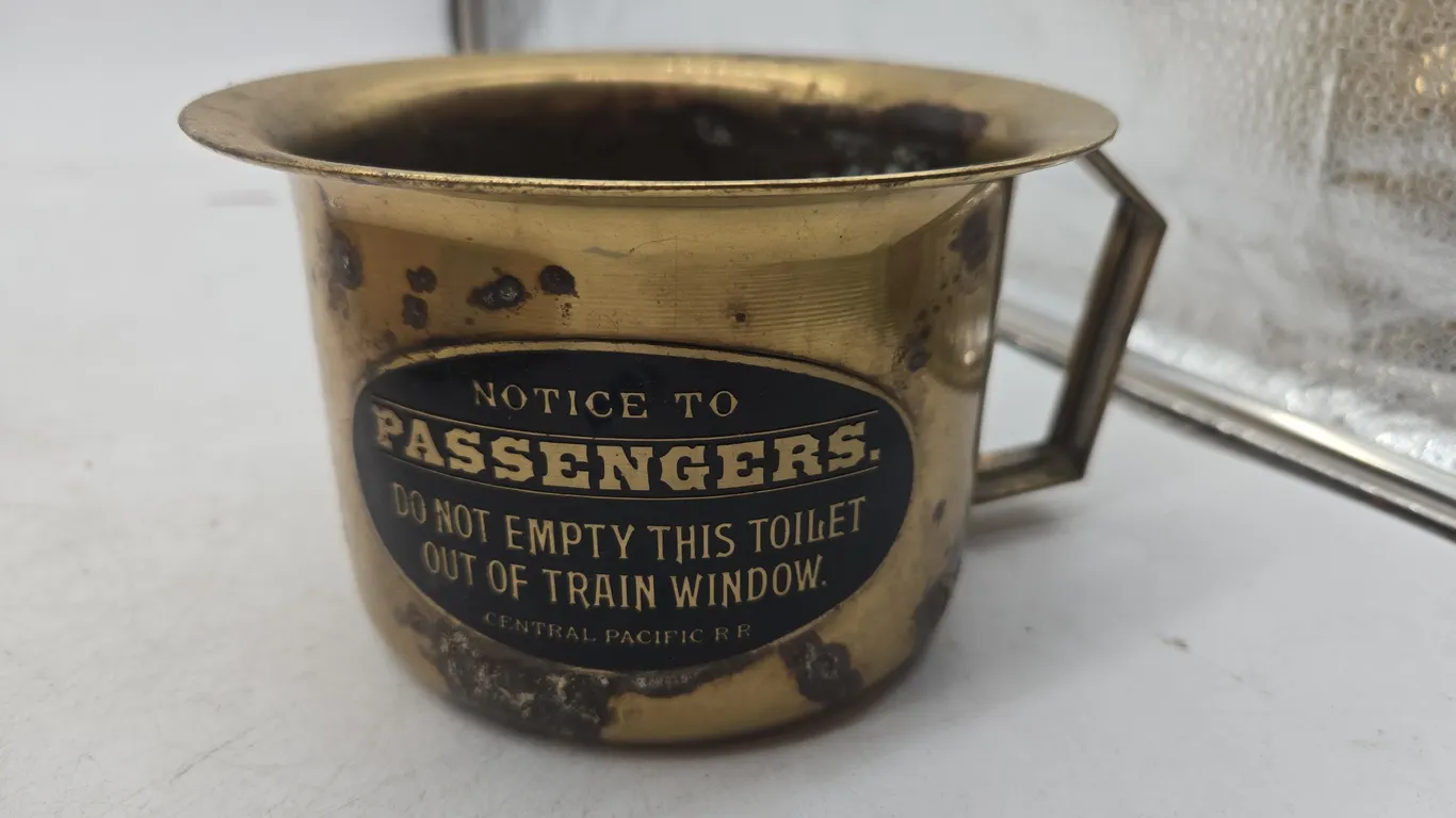 Vintage brass notice to the passengers cup