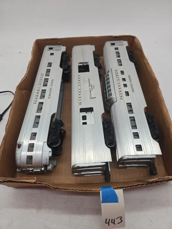 Set of three Lionel lines aluminum silver series passenger car and caboose