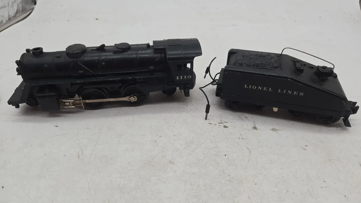 Vintage Lionel steam engine locomotive number 1110 and Lionel lines coal tender number 6403