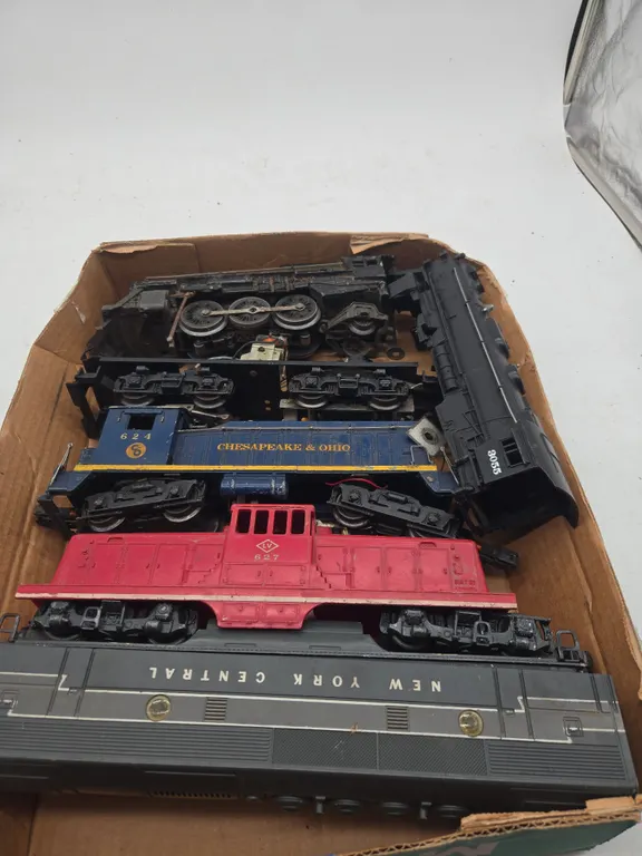 Assorted vintage train locomotive pieces and parts