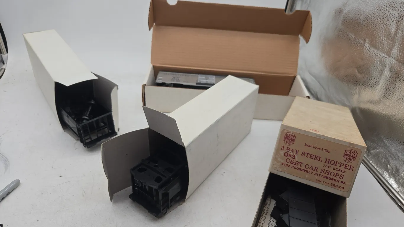 Assorted vintage train car models, new in boxes