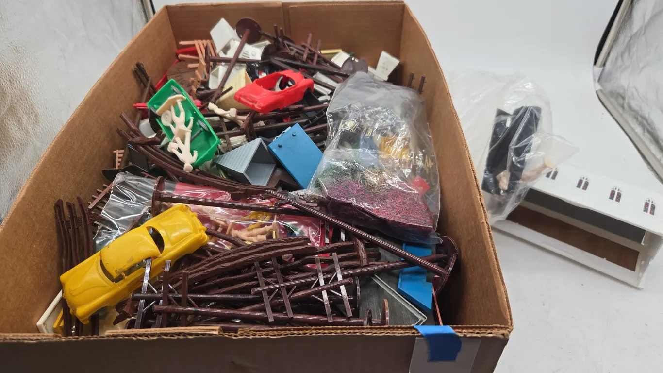 Large assortment of model train layout accessories and buildings