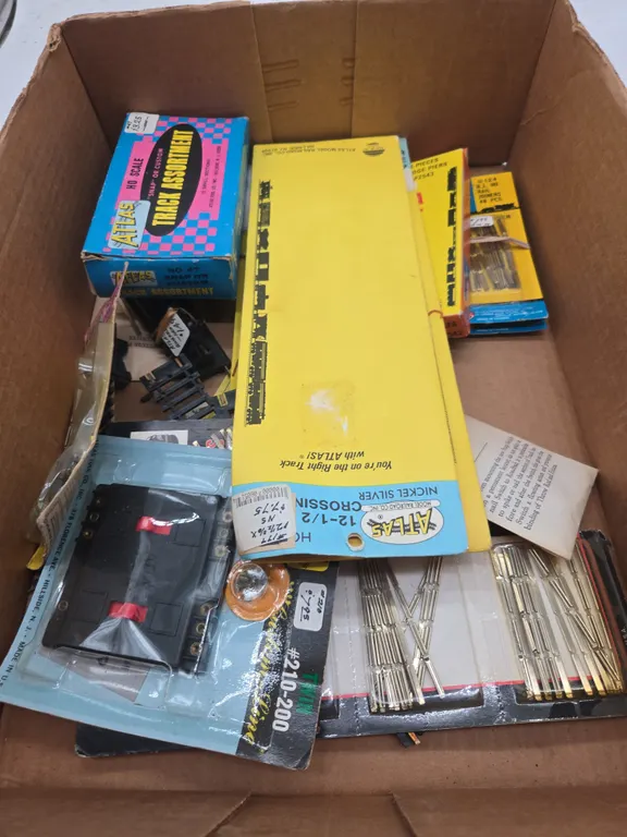 Assorted Atlas brand track accessories new in packages