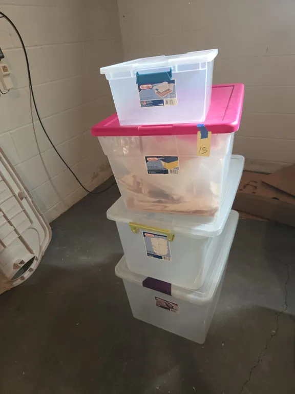 Assorted plastic storage totes