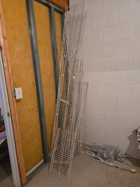 Assorted wall-mounted metal shelving
