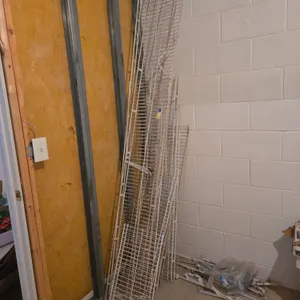 Assorted wall-mounted metal shelving