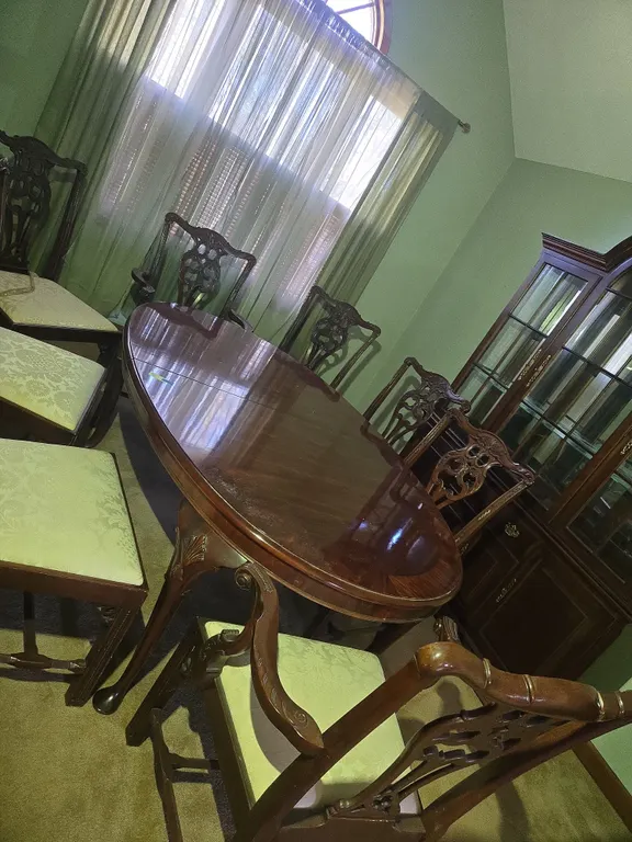Vintage mahogany Chippendale styled dining room table and 8 chairs