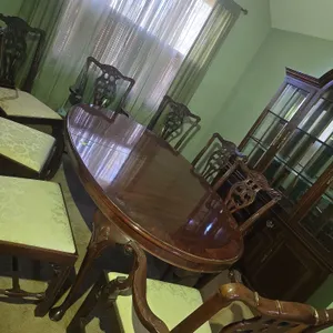 Vintage mahogany Chippendale styled dining room table and 8 chairs