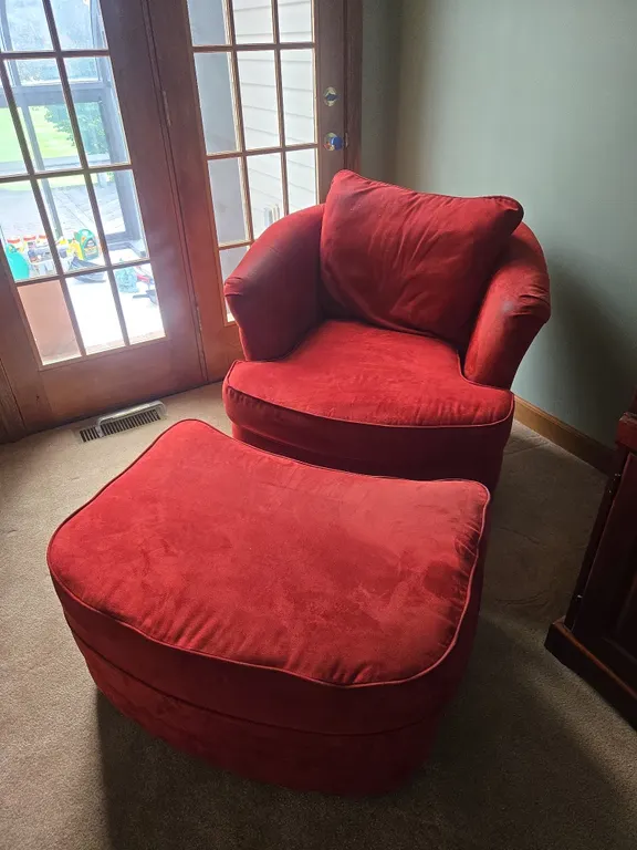 Swivel chair with ottoman.