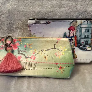 Two Fabric Cosmetic Pouches with Printed Designs