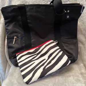 Black Nylon Tote With Zebra-Print Pouch and Red Accents