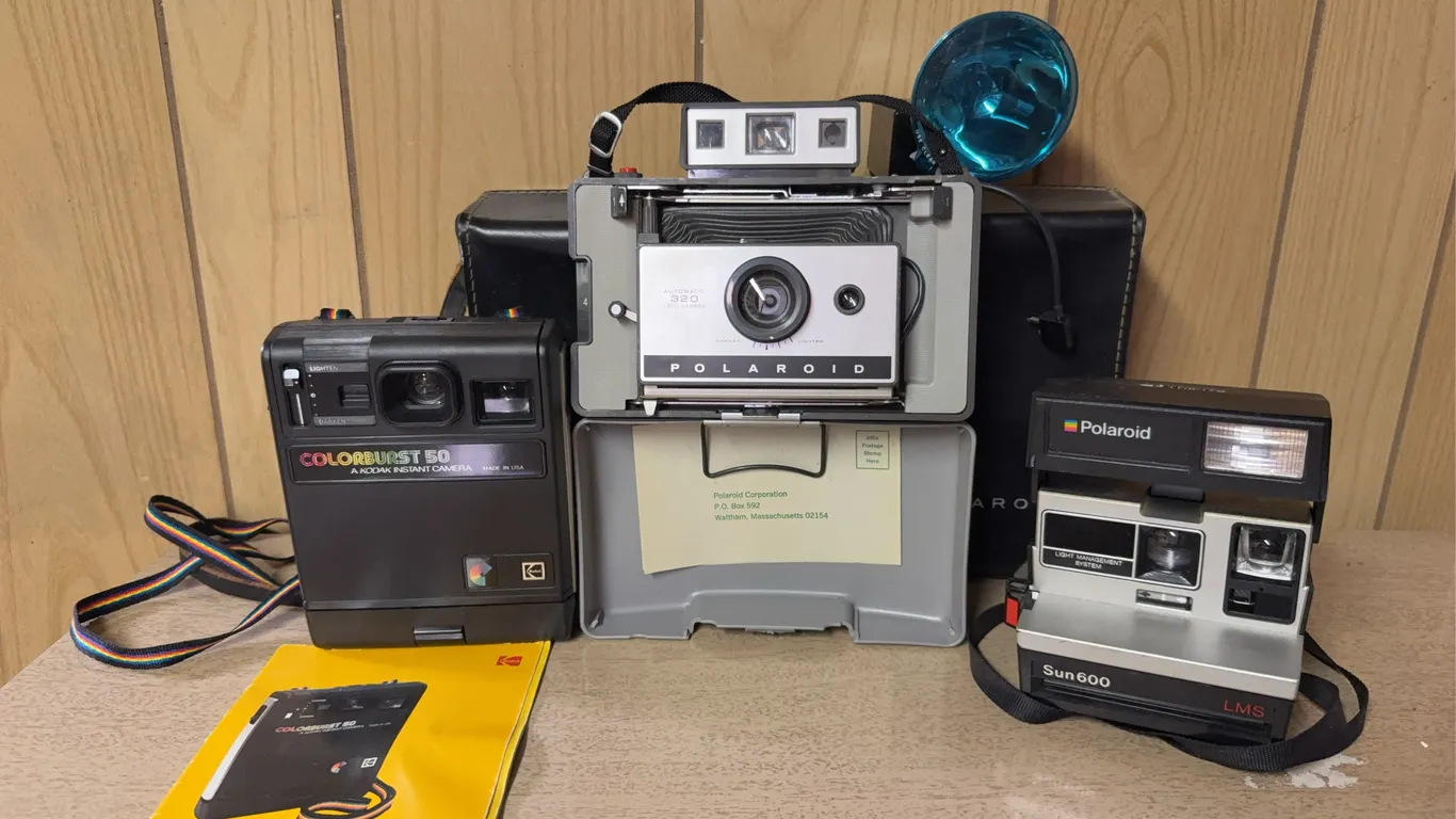 Three Vintage Polaroid Instant Cameras with Cases & Accessories