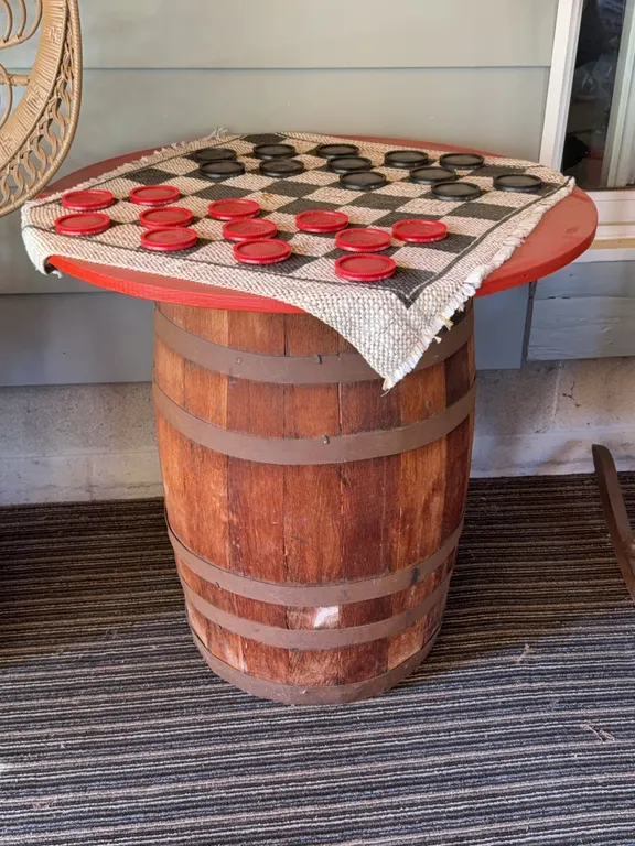 Rustic Wooden Barrel Table with Checkerboard Game