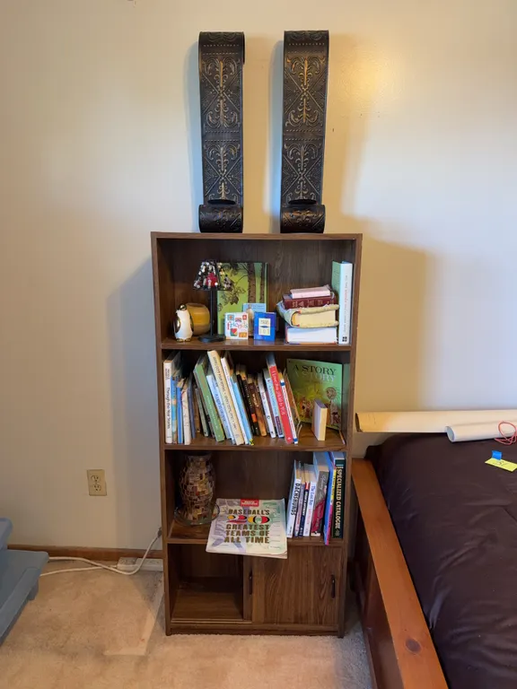 Wooden Bookcase with Books, Decorative Accessories & Metal Wall Décor