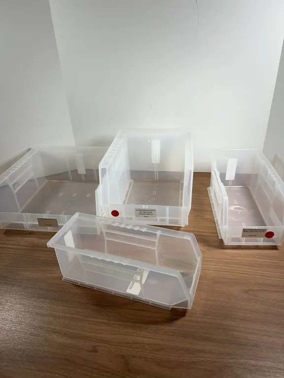 Four Clear Plastic Stackable Storage Bins