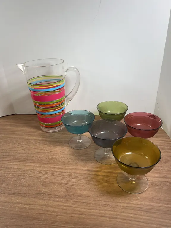Striped plastic Pitcher with Five Colored Stemmed plastic Glasses dessert cups