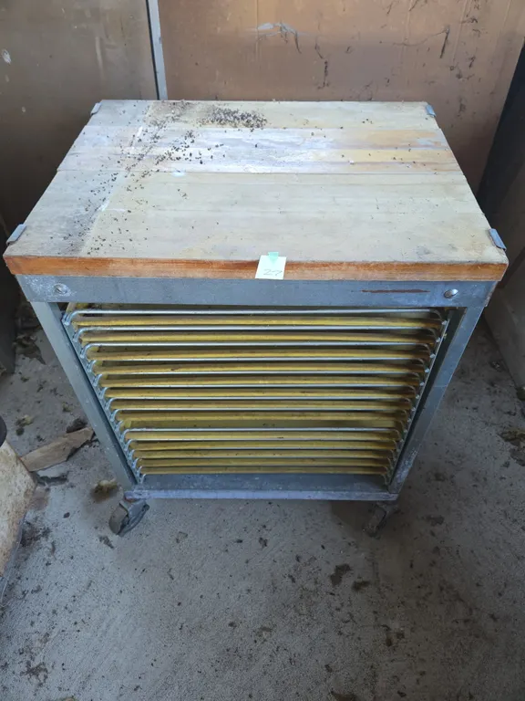Vintage rolling bakery resting cabinet with butcher block top