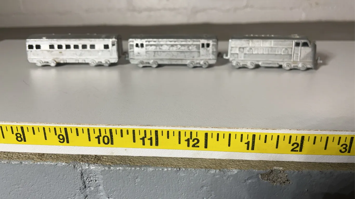 Midge Toy Cast Metal Locomotive and Two Passenger Cars in a Holiday Tin