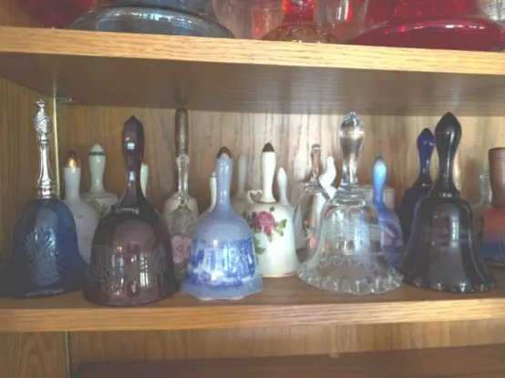 LARGE ASSORTMENT GLASS AND PORCELAIN BELLS