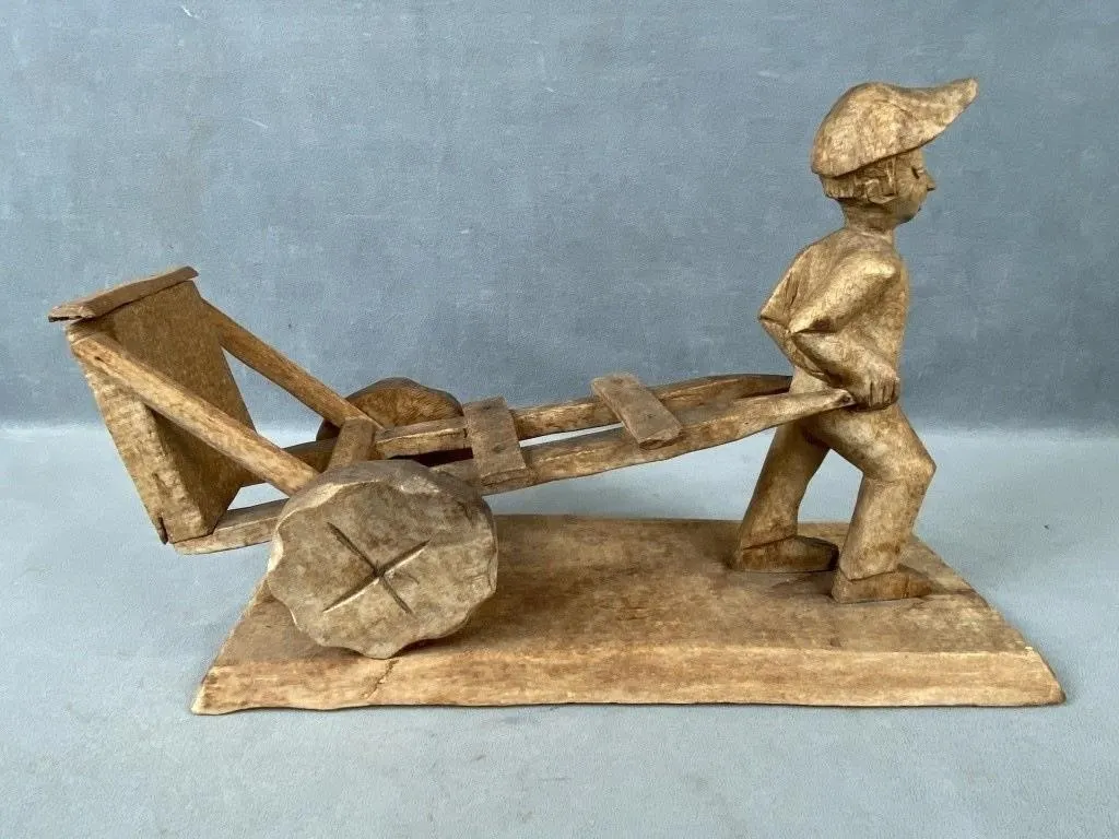 Vintage Carved Quebecois Man Pulling Cart