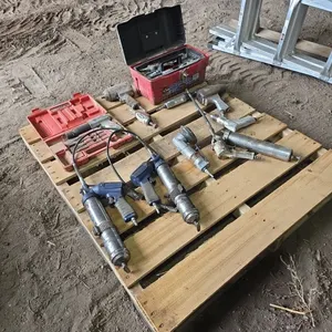 Assorted pneumatic tools including grease guns, grinders, impacts & chisel