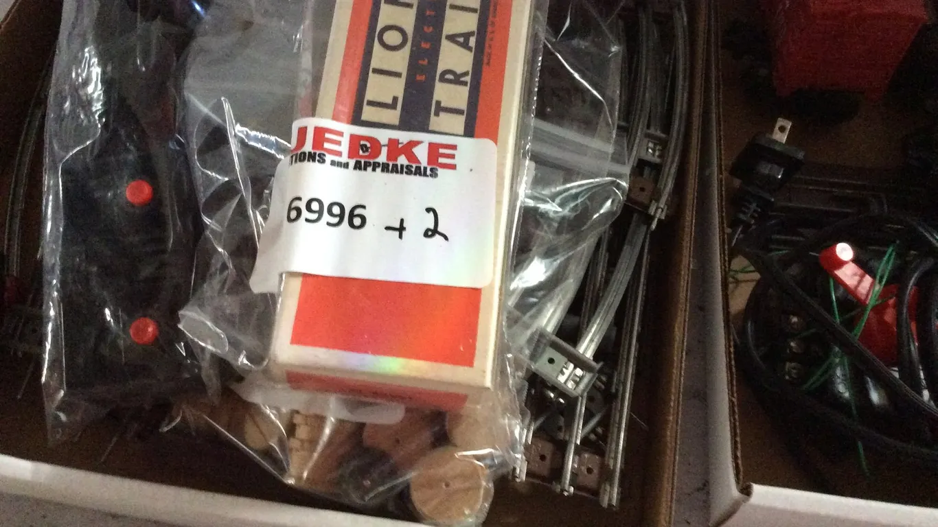 (2) Boxes of Lionel Train Pieces