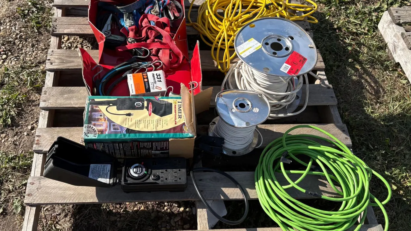 Pallet of electric wire, extension cords, outside electric timer, ratchet straps, box of marrette